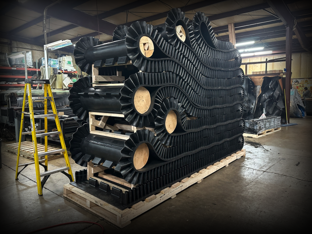 Industrial conveyor belt with sidewalls.